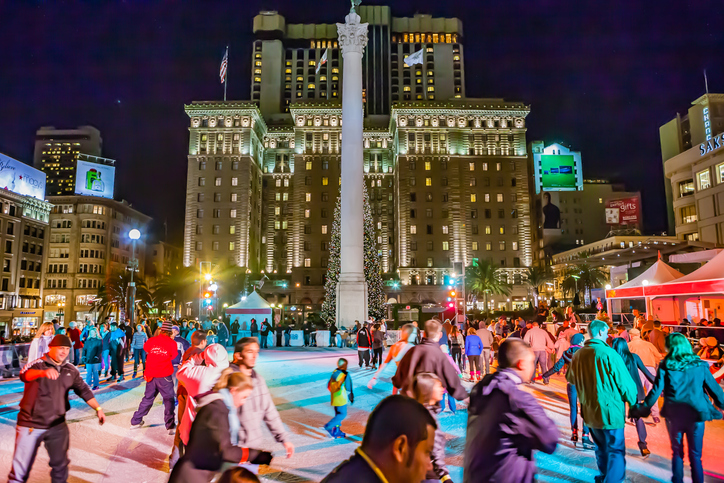 Many people are skating on the skating rink in Union square. Photo by Fabiomichelecapelli / iStock